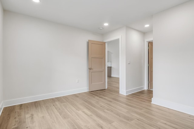 spare room with light hardwood / wood-style floors