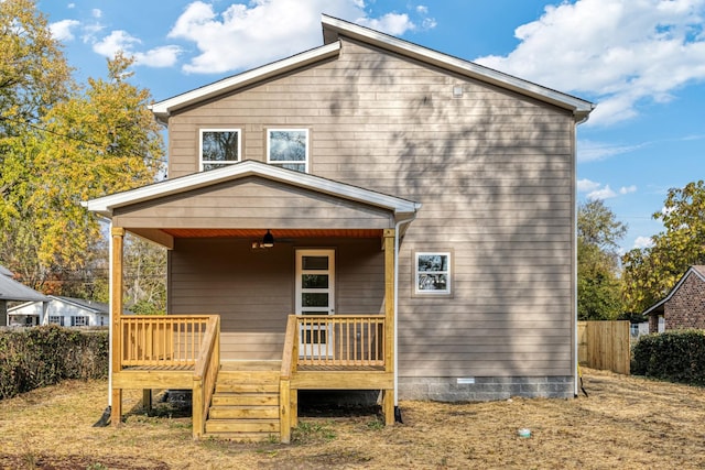 back of house featuring a deck