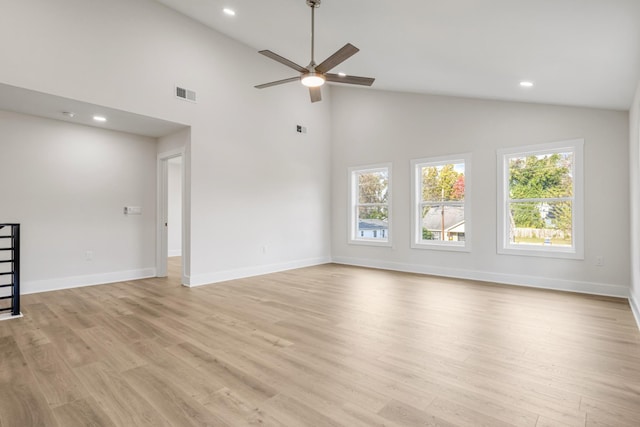 unfurnished living room featuring ceiling fan, light hardwood / wood-style flooring, and high vaulted ceiling