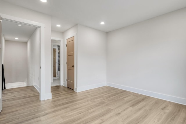 unfurnished room with light hardwood / wood-style flooring