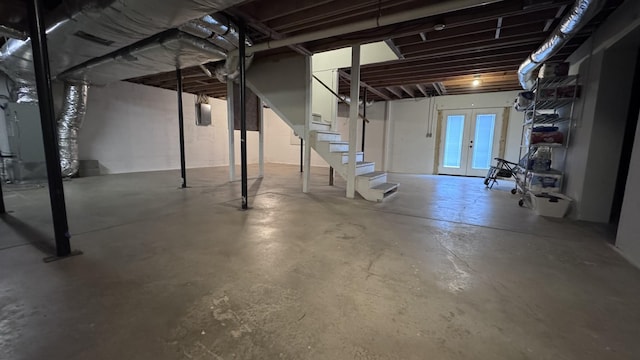 basement featuring heating unit and french doors