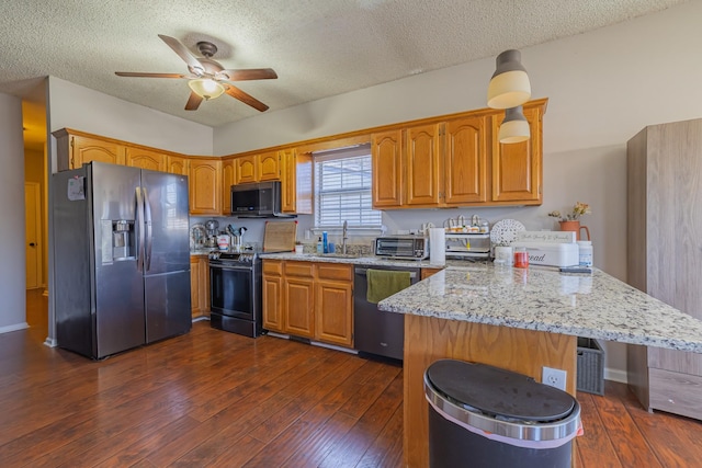 kitchen with black range with electric stovetop, stainless steel fridge, dishwasher, and a textured ceiling