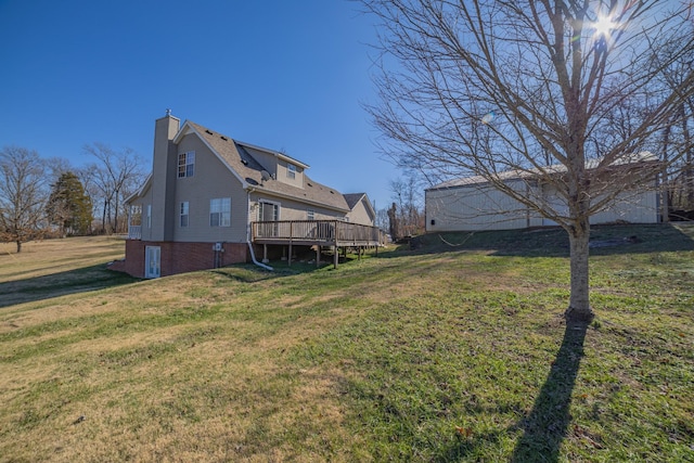 view of yard with a wooden deck