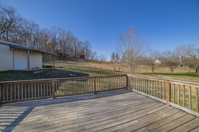 deck featuring a yard and an outdoor structure