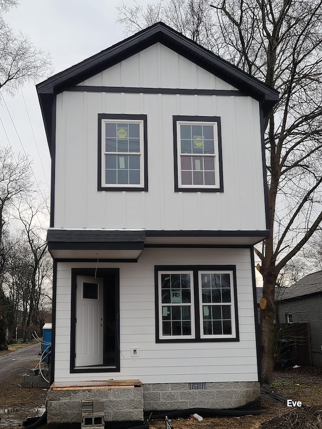 view of front of house with crawl space and board and batten siding