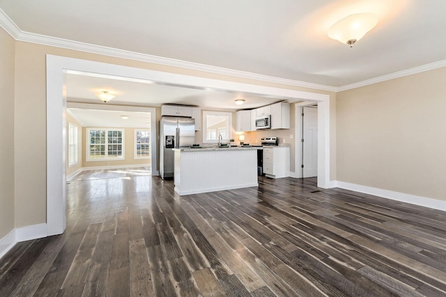 unfurnished living room with dark hardwood / wood-style flooring and ornamental molding