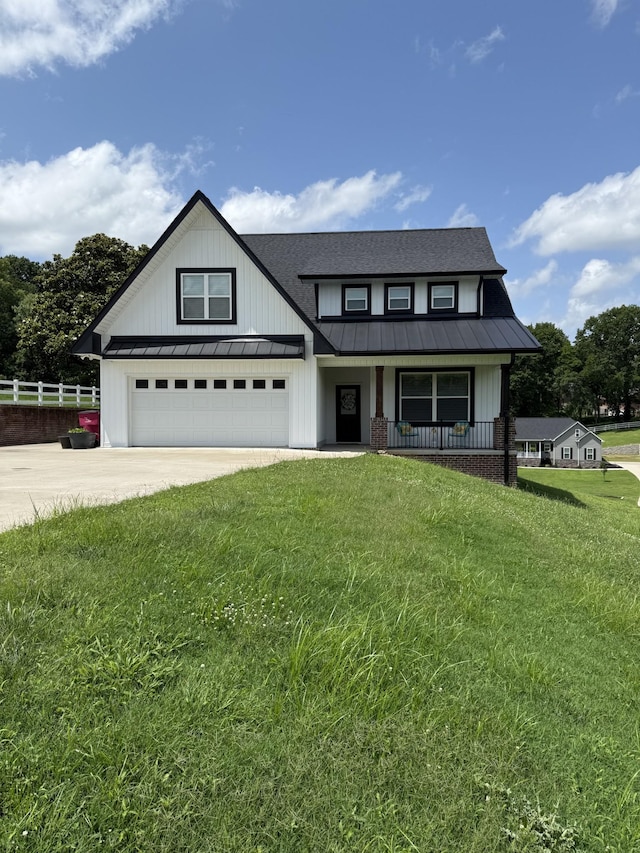733 Jackson Ave, Carthage, TN 37030 - modern farmhouse style home with a standing seam roof, driveway, a metal roof, a porch, and a garage