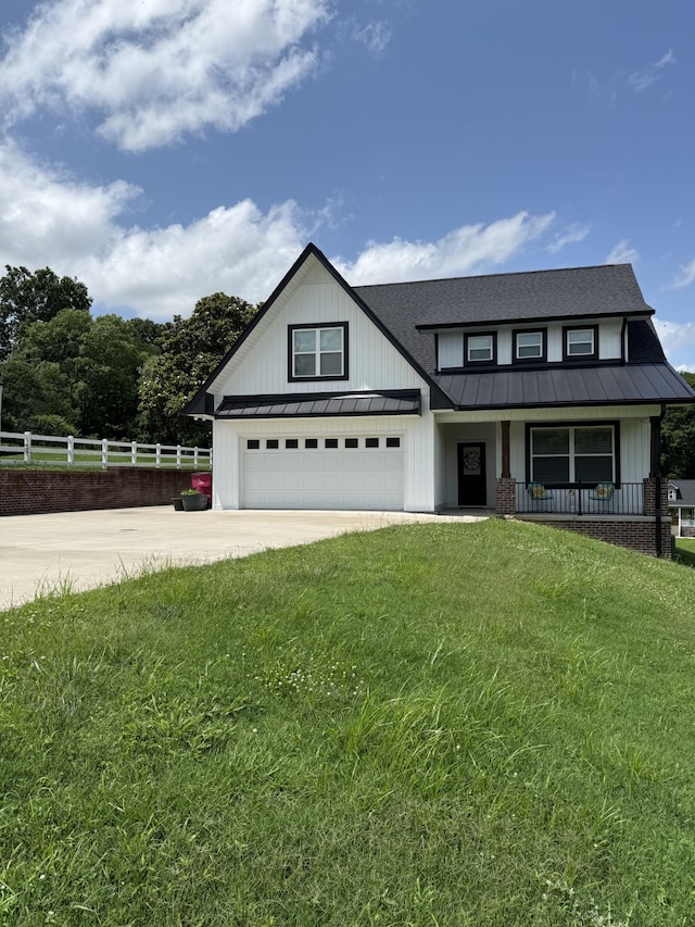 733 Jackson Ave, Carthage, TN 37030 - modern farmhouse style home with a standing seam roof, concrete driveway, covered porch, a metal roof, and board and batten siding