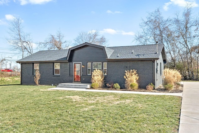 ranch-style home with a front lawn