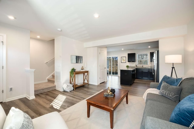 living room with dark hardwood / wood-style flooring