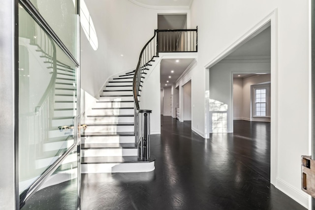 staircase featuring crown molding