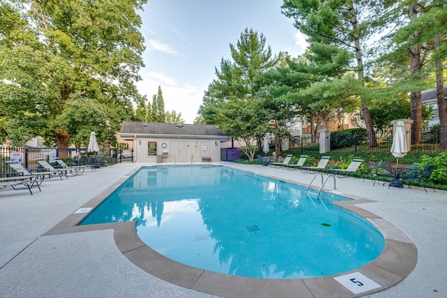 view of swimming pool with a patio