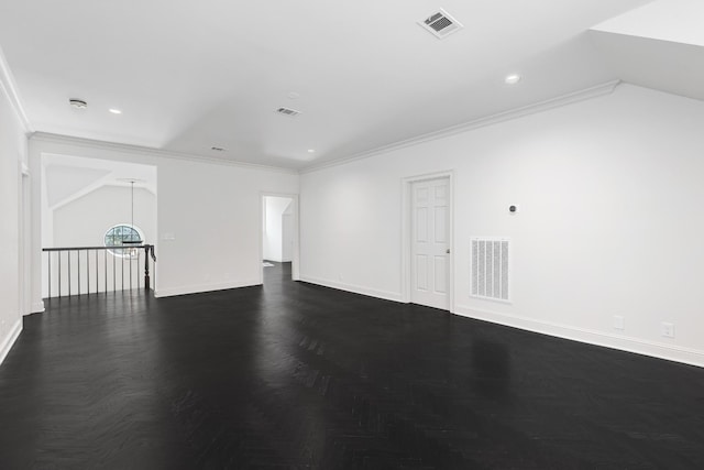 empty room featuring crown molding