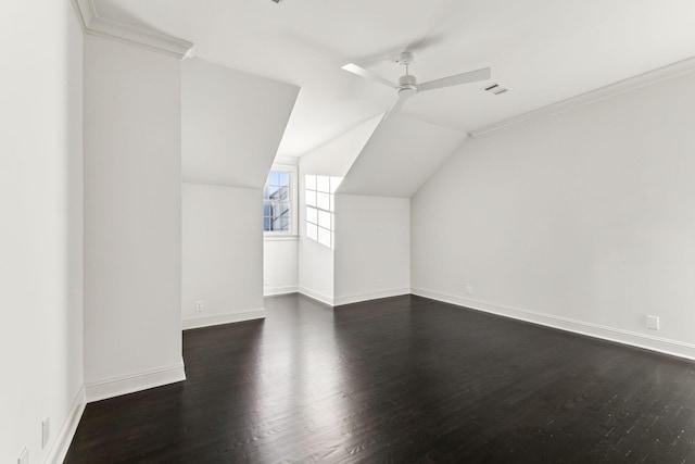 bonus room with ceiling fan, dark wood-type flooring, and vaulted ceiling