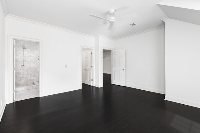 interior space with dark wood-type flooring, ensuite bath, ceiling fan, and ornamental molding