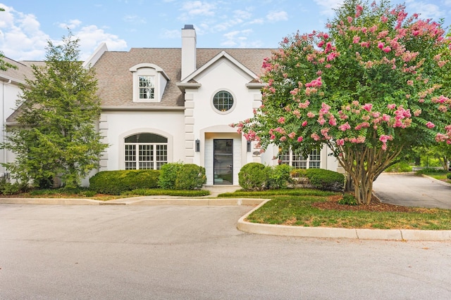 view of french country inspired facade