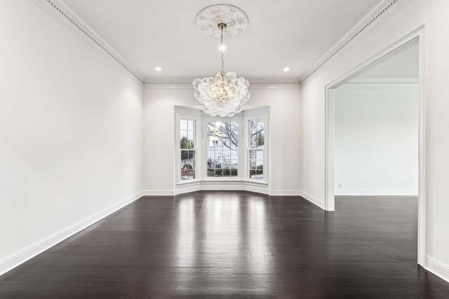 unfurnished dining area with dark wood-type flooring, crown molding, and a notable chandelier