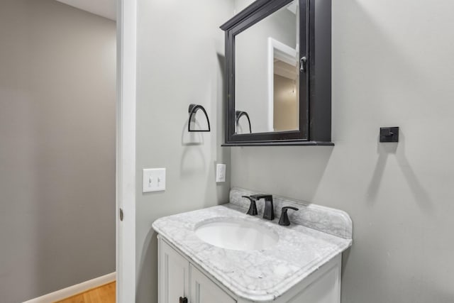 bathroom with wood-type flooring and vanity