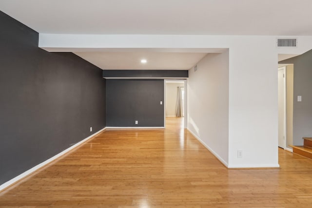 unfurnished room featuring light wood-type flooring