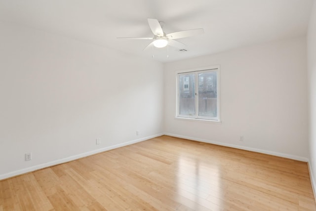 unfurnished room featuring ceiling fan and light hardwood / wood-style flooring