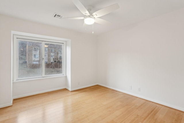 unfurnished room featuring light hardwood / wood-style floors and ceiling fan