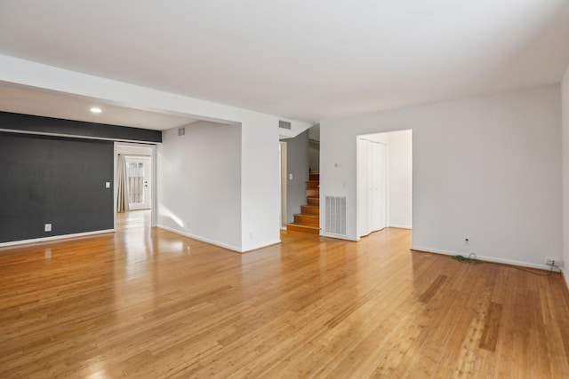 spare room with light wood-type flooring