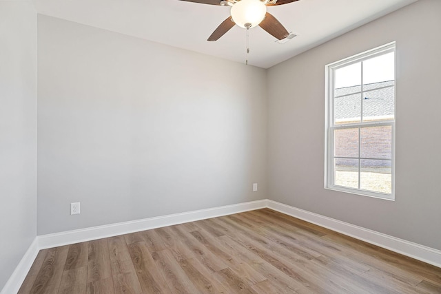 spare room featuring light hardwood / wood-style floors and ceiling fan