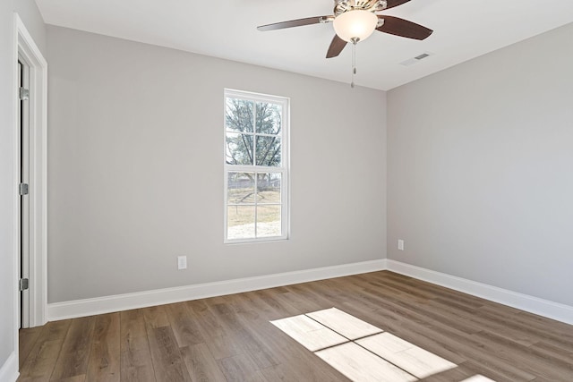 empty room featuring ceiling fan and wood-type flooring