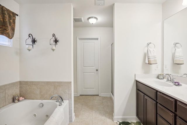 bathroom with tile patterned flooring, vanity, and independent shower and bath