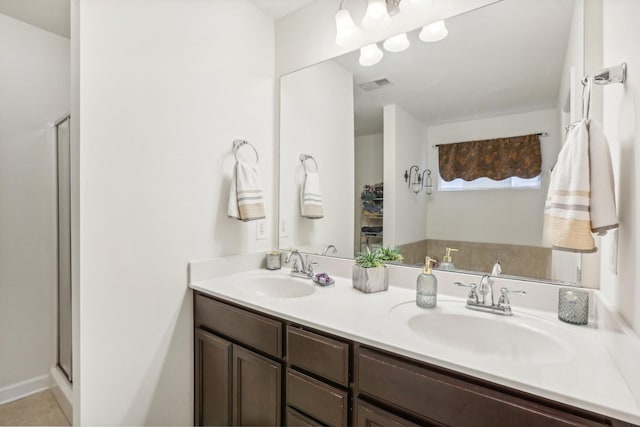 bathroom with vanity and an enclosed shower