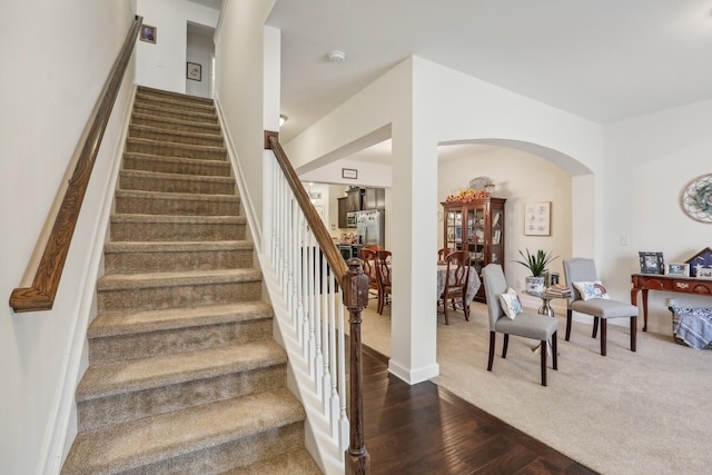 staircase featuring hardwood / wood-style flooring