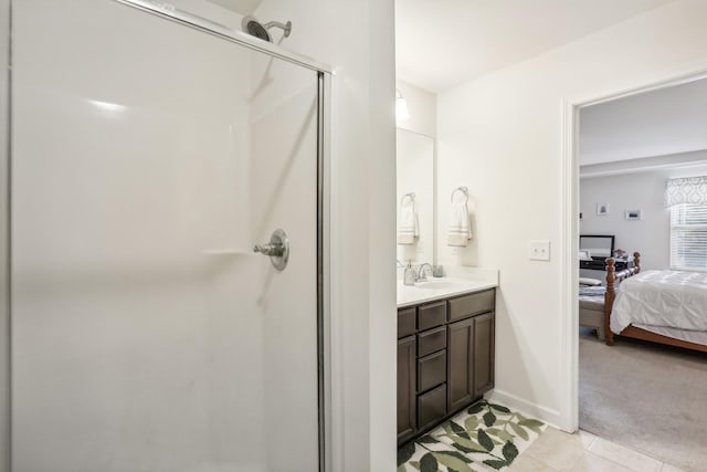 bathroom featuring vanity, tile patterned floors, and walk in shower