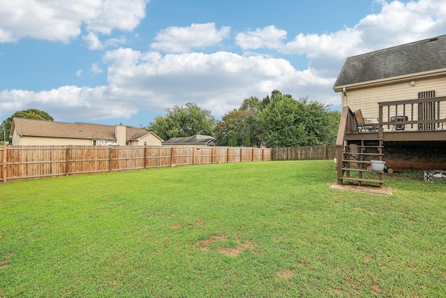 view of yard with a wooden deck