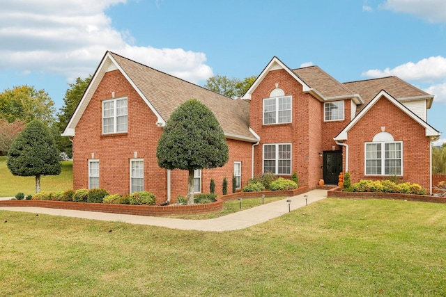 view of property featuring a front yard