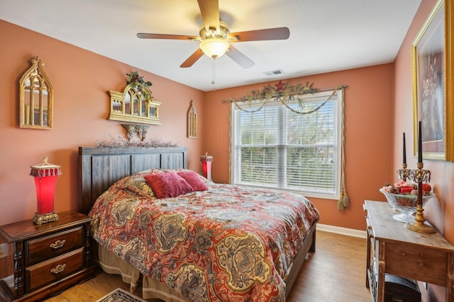 bedroom featuring ceiling fan and light wood-type flooring