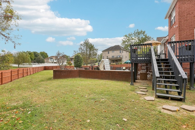 view of yard featuring a wooden deck