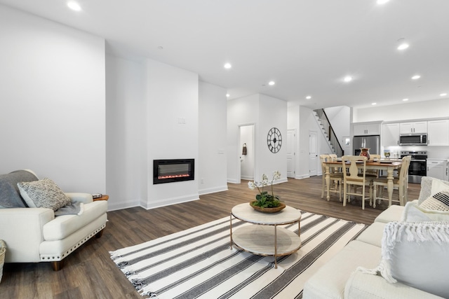 living room featuring dark hardwood / wood-style flooring