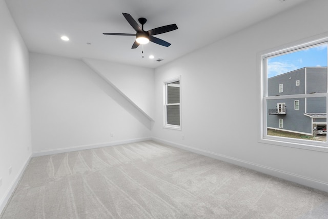 carpeted empty room featuring ceiling fan