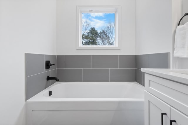 bathroom featuring a bathing tub and vanity