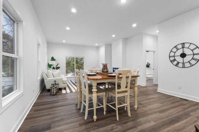 dining area with dark wood-type flooring