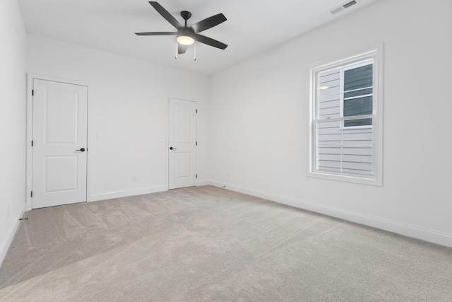 carpeted empty room with ceiling fan