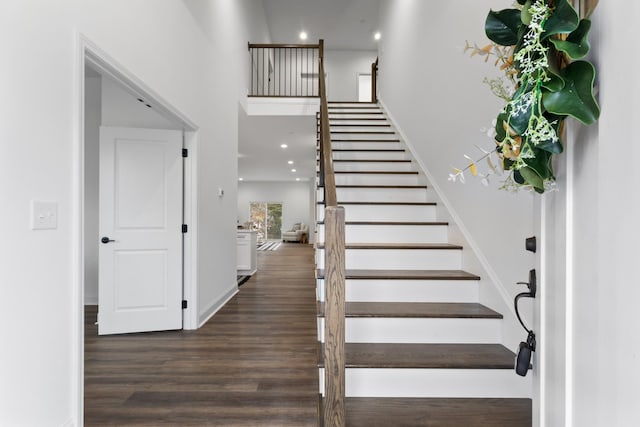 stairs with hardwood / wood-style floors