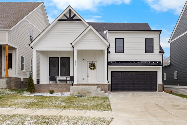 view of front of house featuring covered porch and a garage