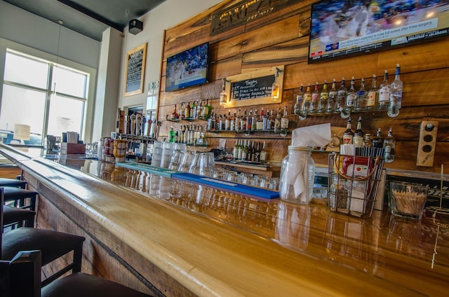 bar featuring wooden walls