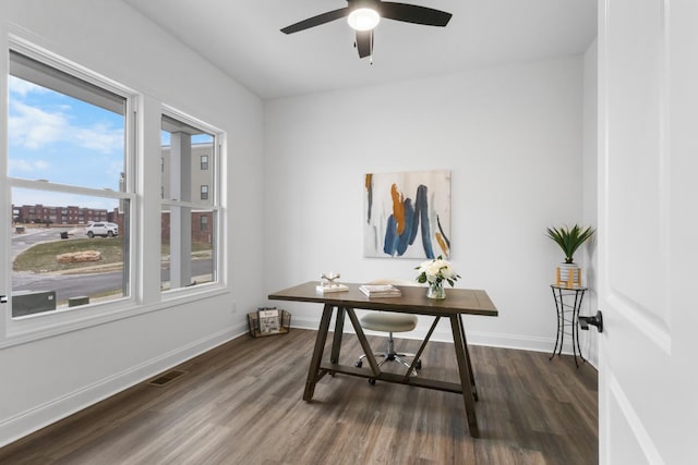 office space with ceiling fan and dark hardwood / wood-style floors