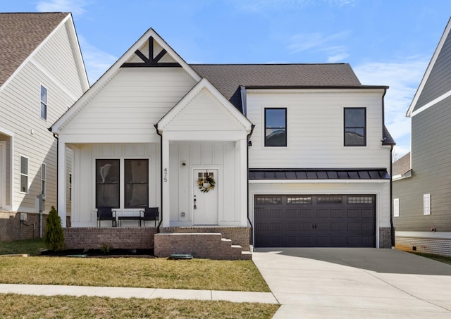 modern farmhouse style home with a front yard, driveway, a porch, a garage, and brick siding