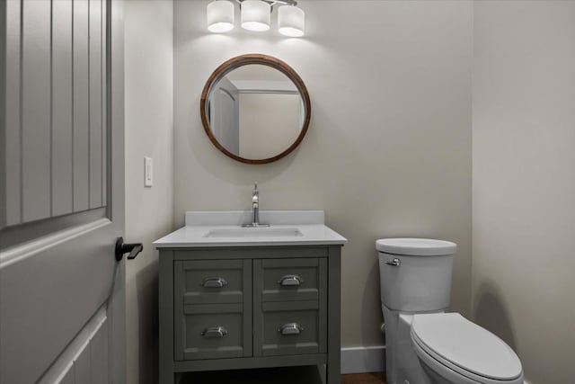 bathroom featuring toilet and vanity