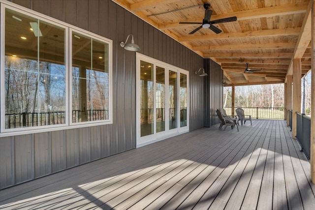 deck with ceiling fan and a porch