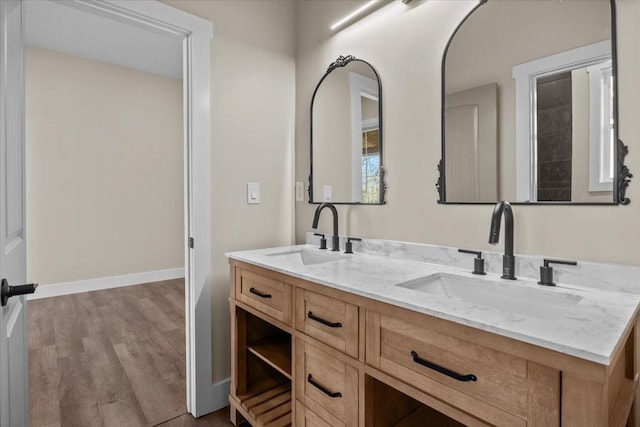 bathroom with vanity and wood-type flooring