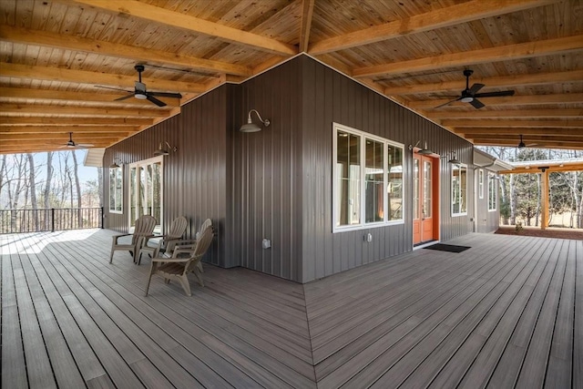 wooden terrace featuring ceiling fan